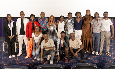 A group of filmmakers and guests standing together after a screening